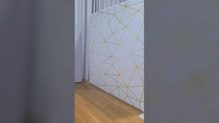 Hintergrund aus goldenem geometrischem Spannungsstoff